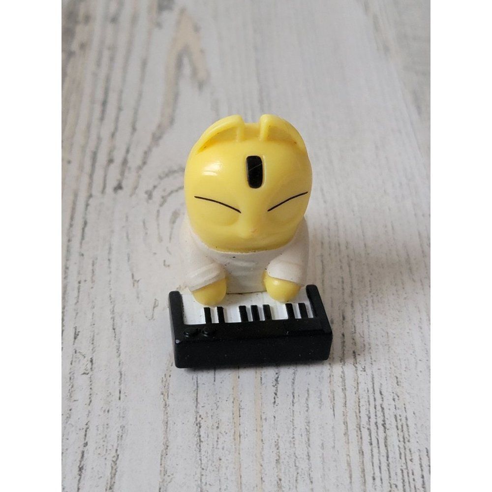 Mini yellow cat piano keyboard toy figure pet
